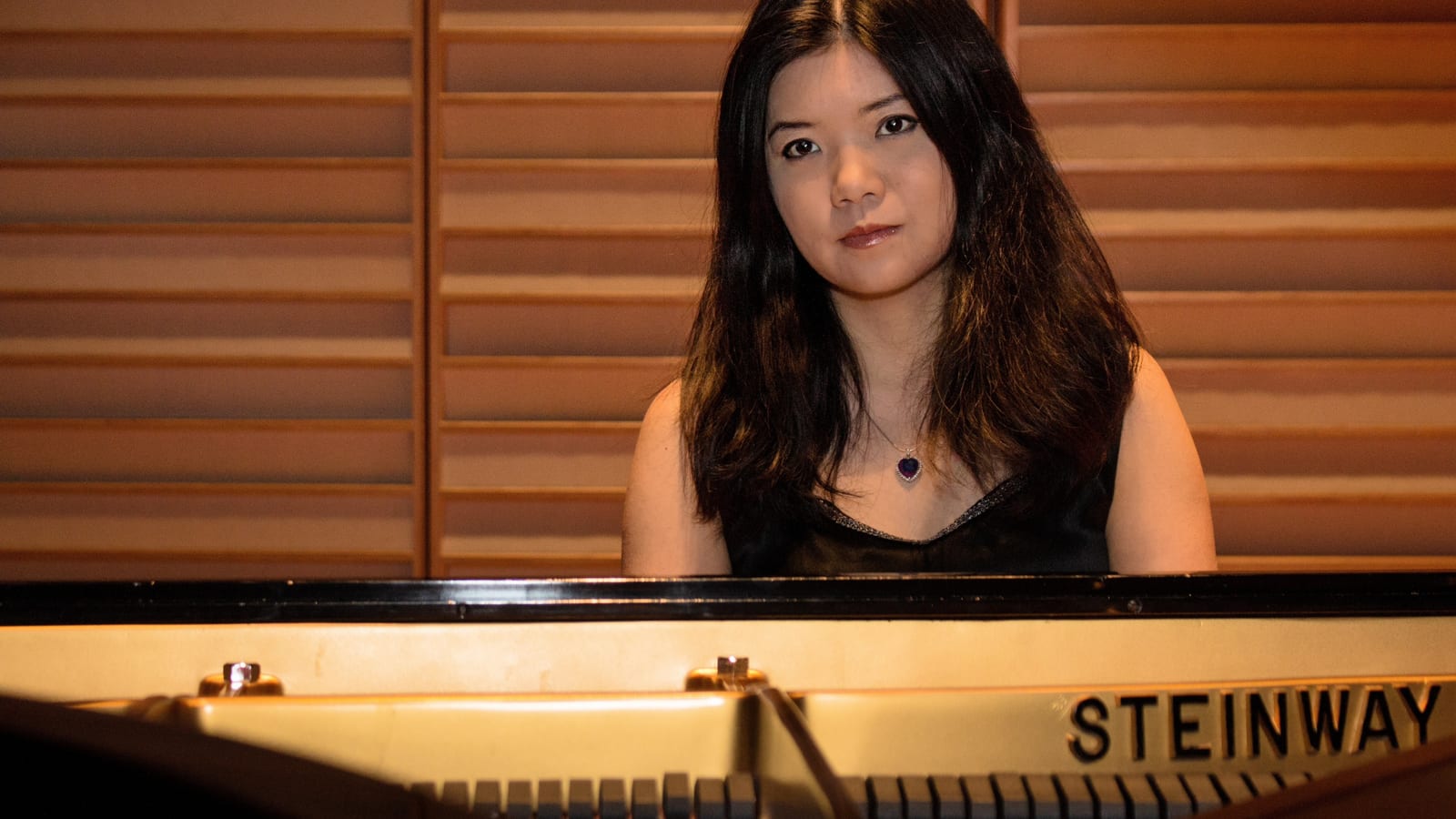 Woman pianist at Steinway grand piano