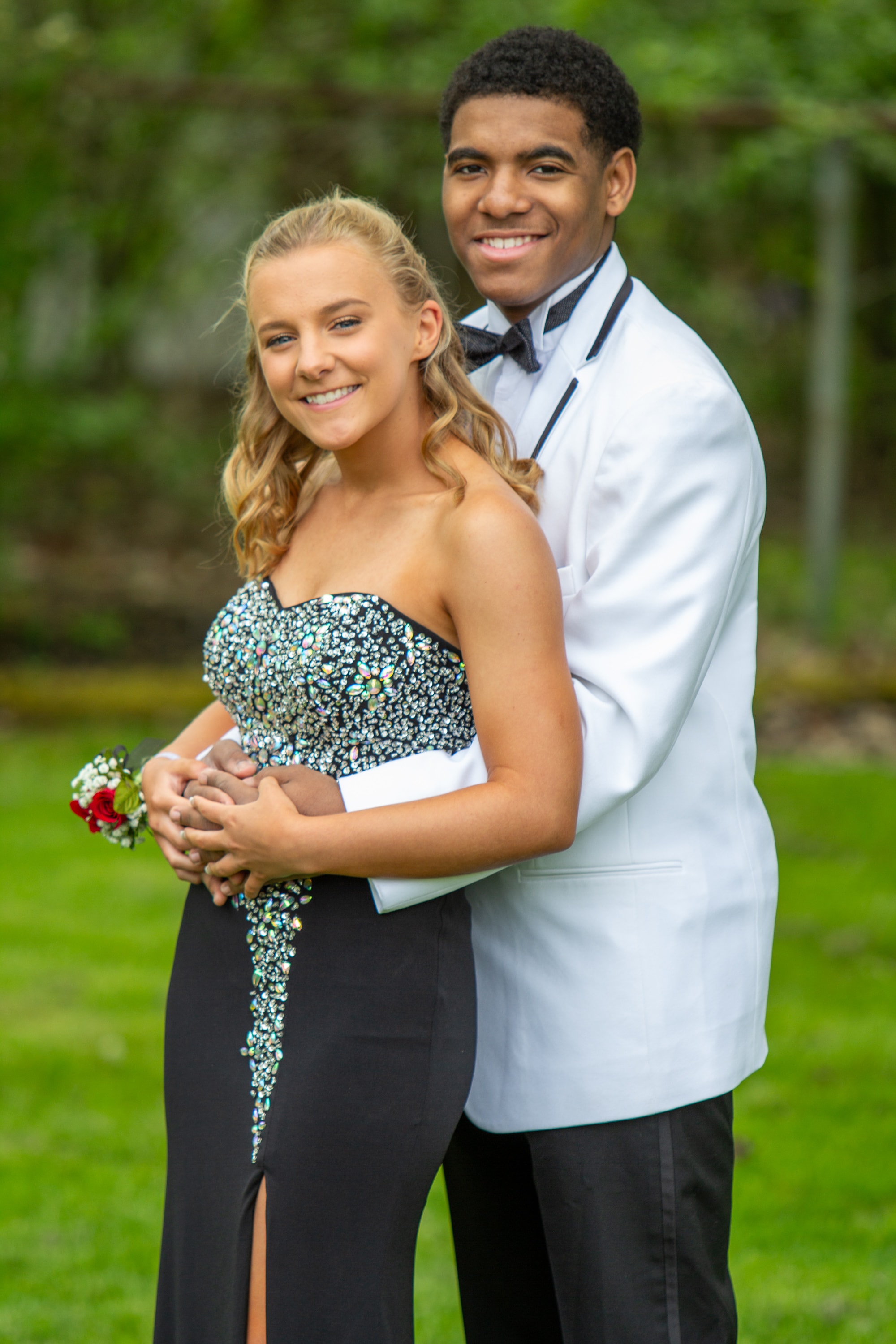 Prom couple in formal attire outdoors